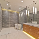 A variety of silhouette lighting gives this contemporary bathroom an edge.
